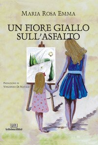 Un fiore giallo sull'asfalto
