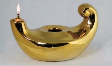 LUCERNETTA "ALADINO" - Realizzata in porcellana, color oro lucido. Lunghezza 12 cm.